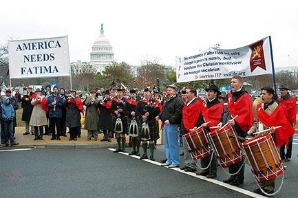 The Holy Choirs of Angels Marching Band with six bagpipers enlivened the event with patriotic music