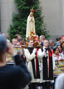 Statue of Our Lady of Fatima during the 2011 Public Square Rosary Rally in New York City, carried by members of The American TFP in ceremonial habit.