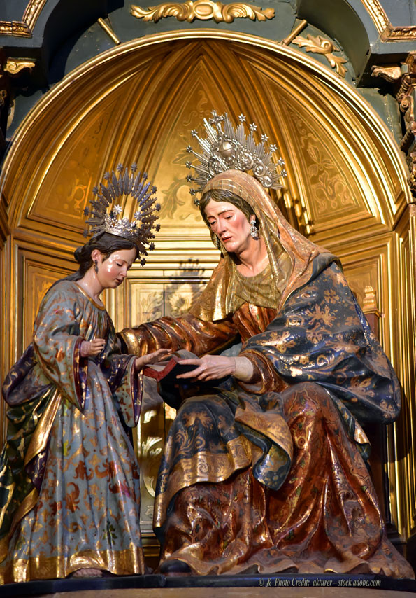 A statue of Saint Anne teaching the Blessed Virgin Mary On the Feast of Saint Anne, nudity and homosexuality Are Promoted outside Her Cathedral